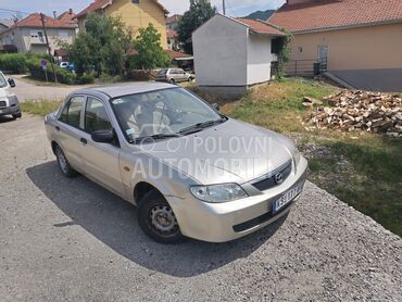 Mazda 323, 380 €, 2003. Limuzina, Benzin + Gas (TNG) | 1290 cm3, 200.000 km, 54kW (73 KS), Manuelni 5 brzina, 4/5 vrata, 5 sedišta, Brus