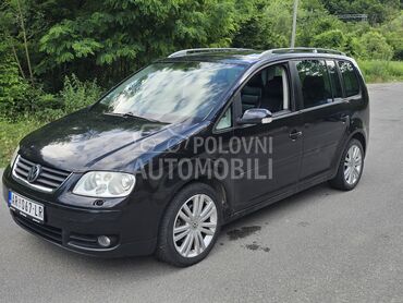 Volkswagen Touran, 1.750 €, 2005. Monovolumen (MiniVan), Dizel | 1968 cm3, 22.130 km, 103kW (140 KS), Automatski / poluautomatski, 4/5 vrata, 5 sedišta, Jajinci