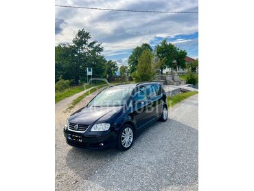 Volkswagen Touran 2.0 TDI, 5.199 €, 2006. Monovolumen (MiniVan), Dizel | 2000 cm3, 294.789 km, 103kW (140 KS), Manuelni 6 brzina, 4/5 vrata, 5 sedišta, Kragujevac