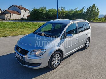 Volkswagen Touran (može zamena), 4.300 €, 2007. Monovolumen (MiniVan), Benzin + Metan (CNG) | 2000 cm3, 344.870 km, 81kW (110 KS), Manuelni 5 brzina, 4/5 vrata, 5 sedišta, Čačak