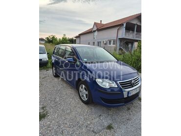Volkswagen Touran, 3.250 €, 2007. Monovolumen (MiniVan), Dizel | 1896 cm3, 234.000 km, 77kW (105 KS), Manuelni 6 brzina, 4/5 vrata, 5 sedišta, Beograd