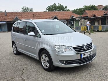 Volkswagen Touran 2.0, 3.490 €, 2007. Monovolumen (MiniVan), Benzin + Metan (CNG) | 1984 cm3, 212.000 km, 80kW (109 KS), Manuelni 5 brzina, 4/5 vrata, 7 sedišta, Pančevo