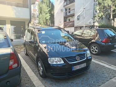 Volkswagen Touran 2.0 TDI, 2.900 €, 2005. Monovolumen (MiniVan), Dizel | 1983 cm3, 247.000 km, 103kW (140 KS), Automatski / poluautomatski, 4/5 vrata, 5 sedišta, Beograd