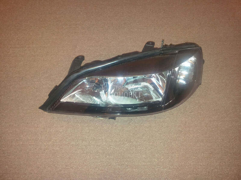Far crni levi za Opel Astra G